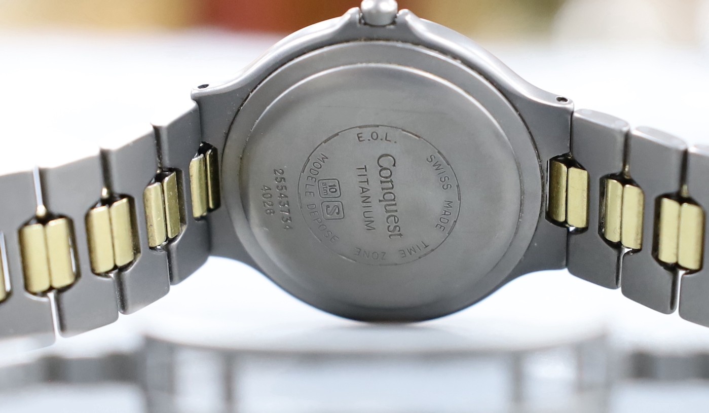 A gentleman's modern steel? and gold plated Longines TI VHP Quartz wristwatch, with box and some papers.